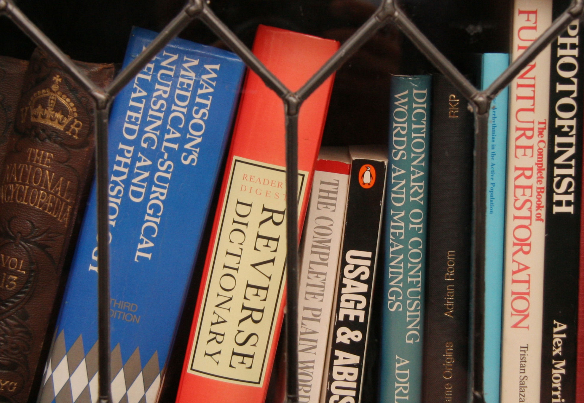 a close up of a book shelf filled with books