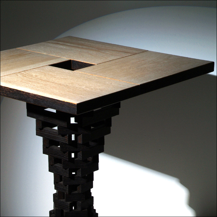 a wooden table that has a square shaped cut out