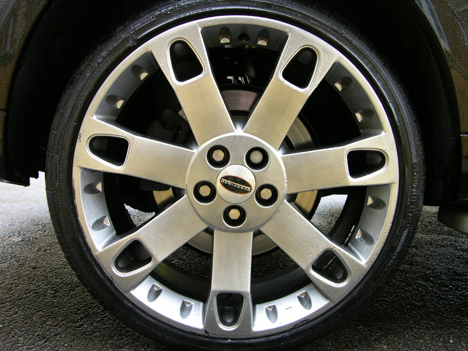 the front tire and wheel of a small car