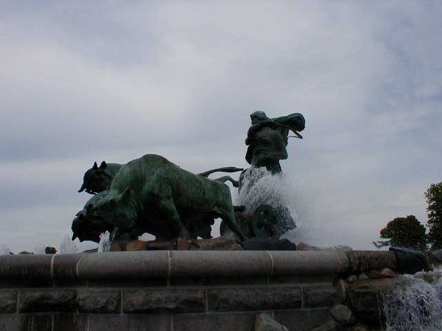 two statues of animals and three smaller ones