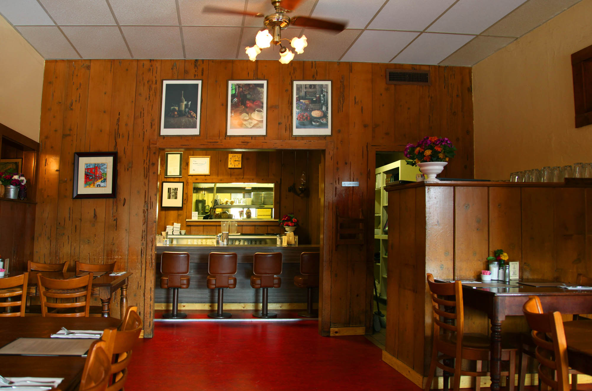 a dimly lit room with wood paneled walls