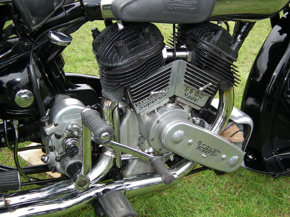 a motorcycle with chrome exhaust pipes and chrome exhaust