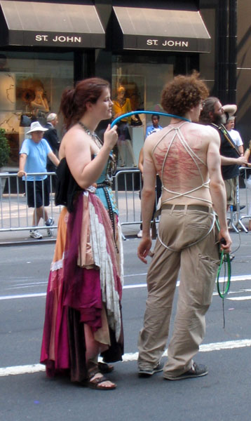a woman and man are standing in the street