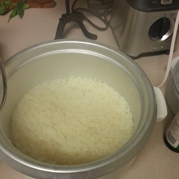 rice is being cooked in a slow cooker