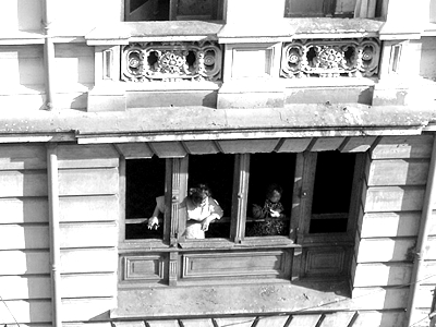 two people looking out from one window in black and white