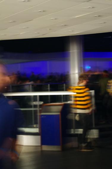 blurry pograph of a blurry man walking in an airport