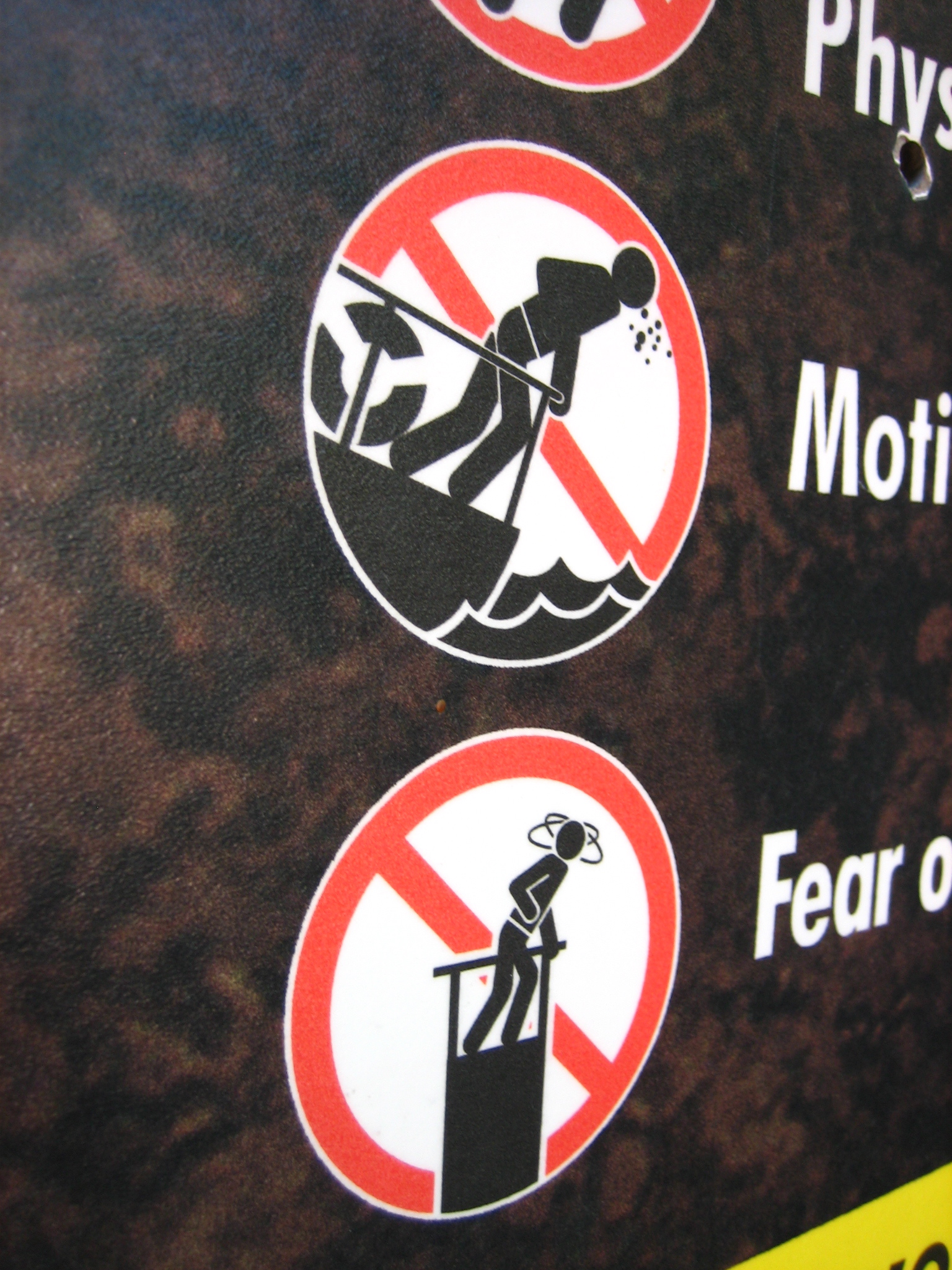 stickers showing two symbols depicting dangers of physical and non - physical devices