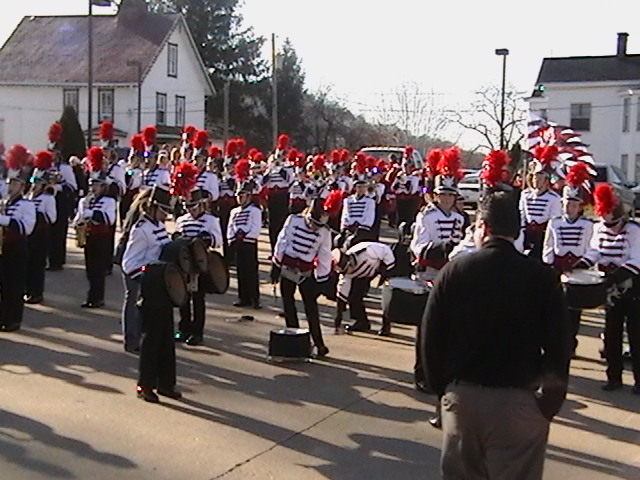 a group of people in marching outfits