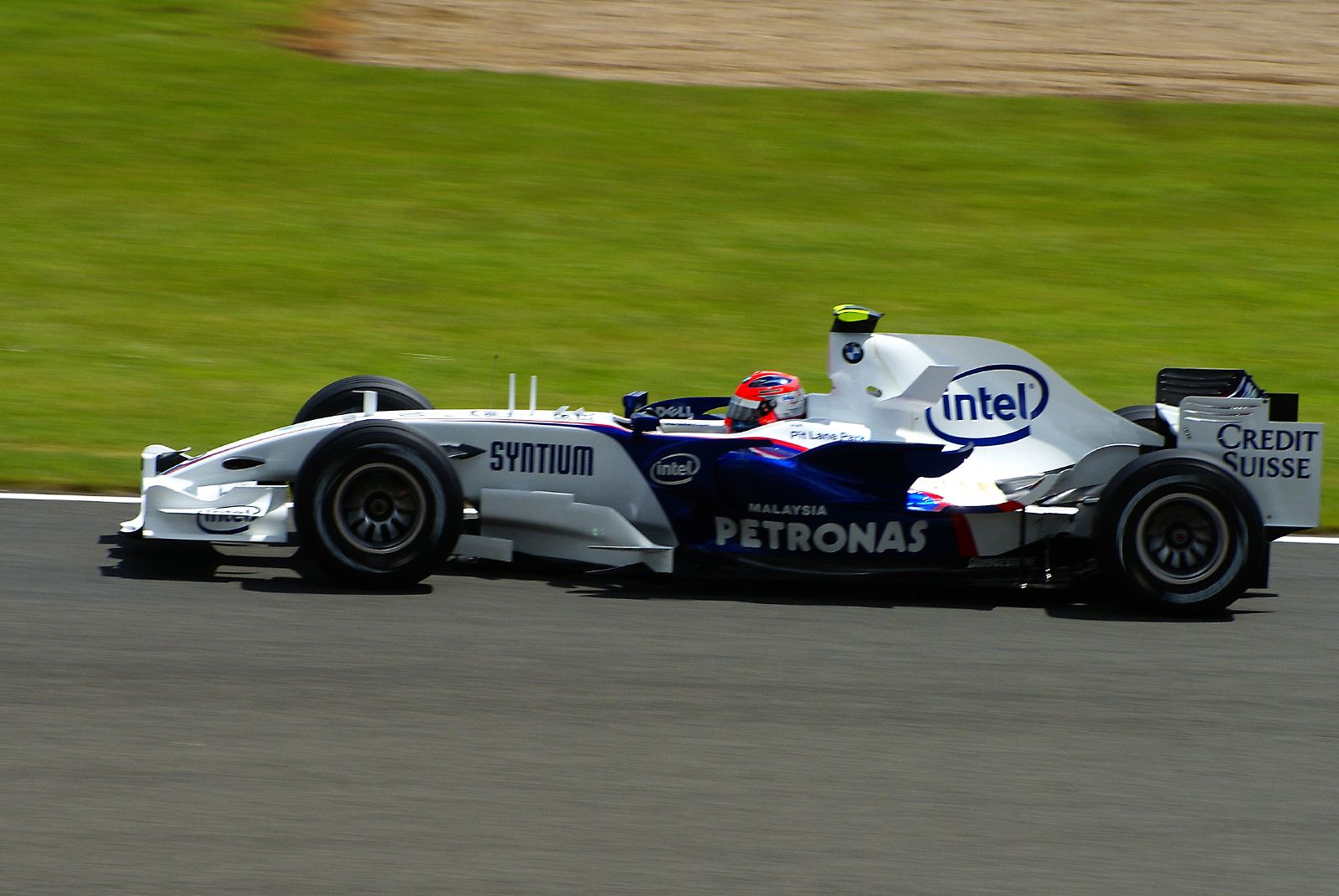 a man in a racing car on the track