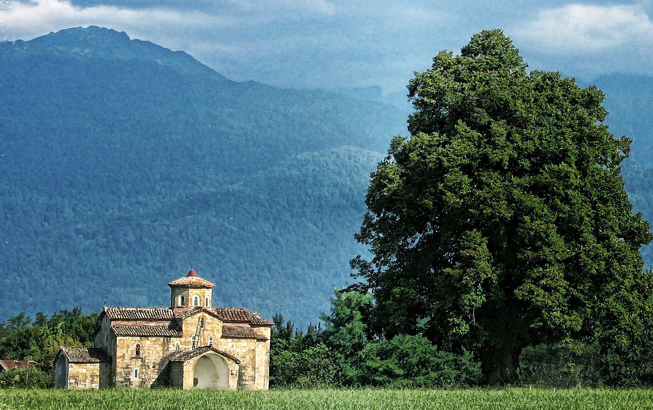 old stone church on the edge of mountains