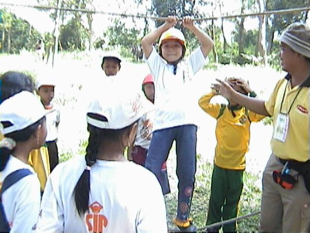 several people in sports apparel holding soing with the hands