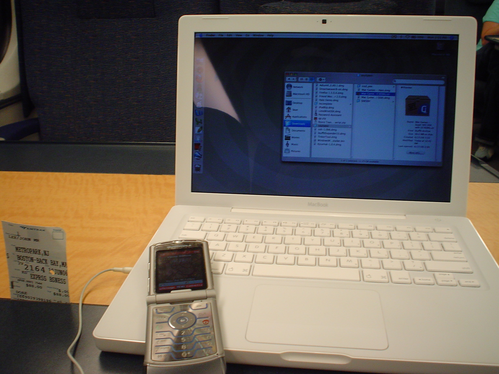 a small electronic device and cellphone are on the table