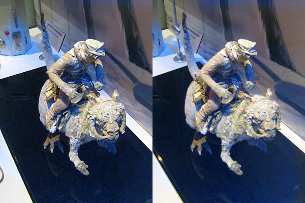 a figurine of a man riding on the back of a bull