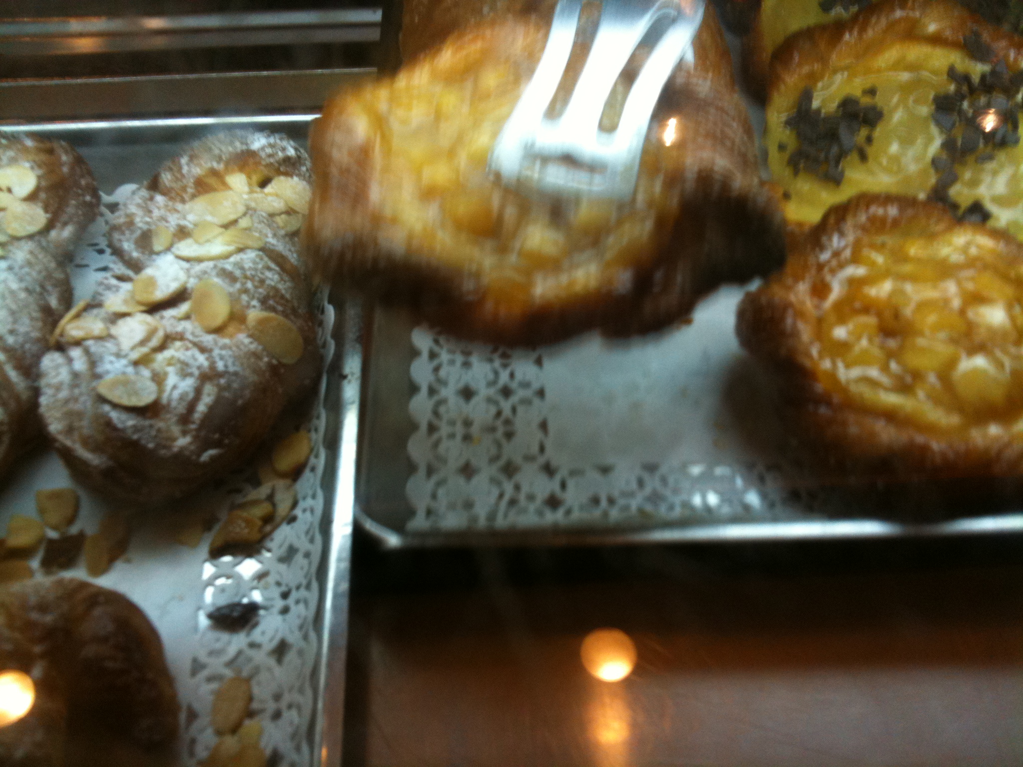 a table topped with lots of food covered in icing