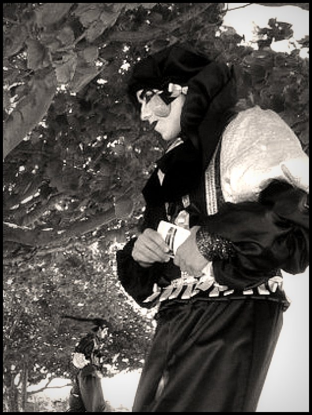a man in traditional russian costume is outside