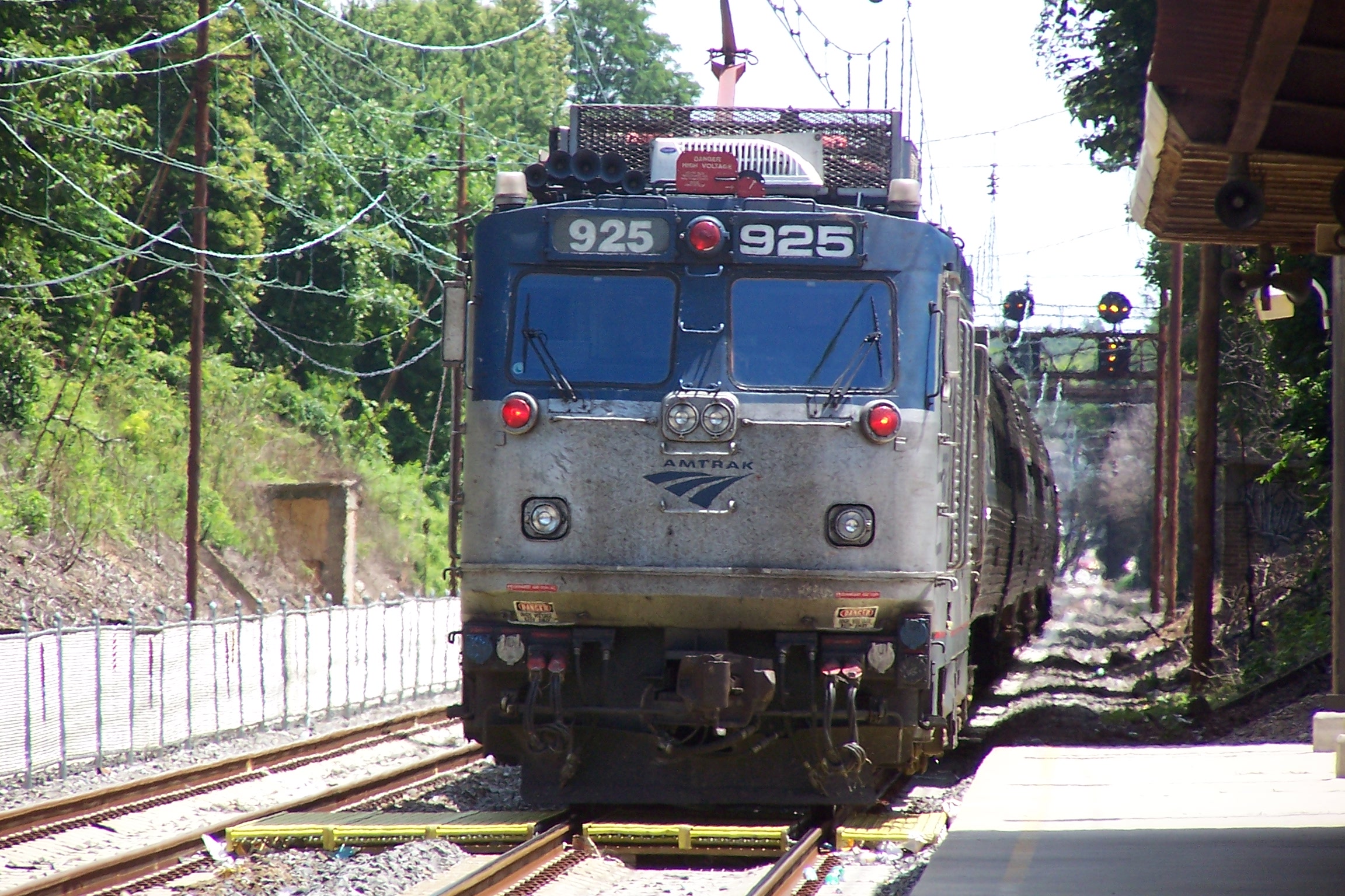 an electric commuter train pulling into the station