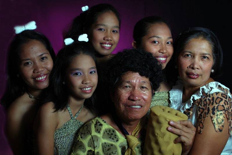 several women and children posing for a po