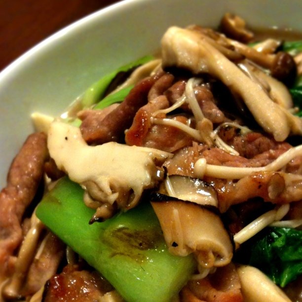 a bowl is filled with cooked veggies and beef