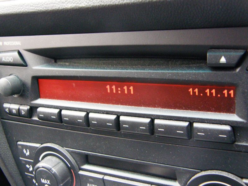 an old radio with the time displayed in red