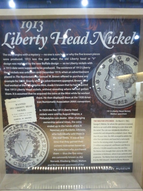 a display case filled with silver coins