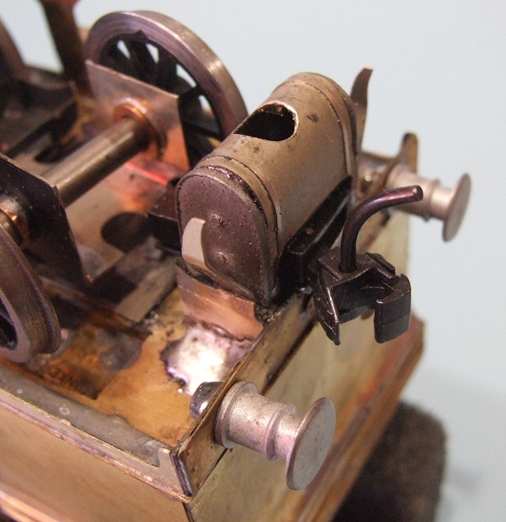 an old antique sewing machine has four gears
