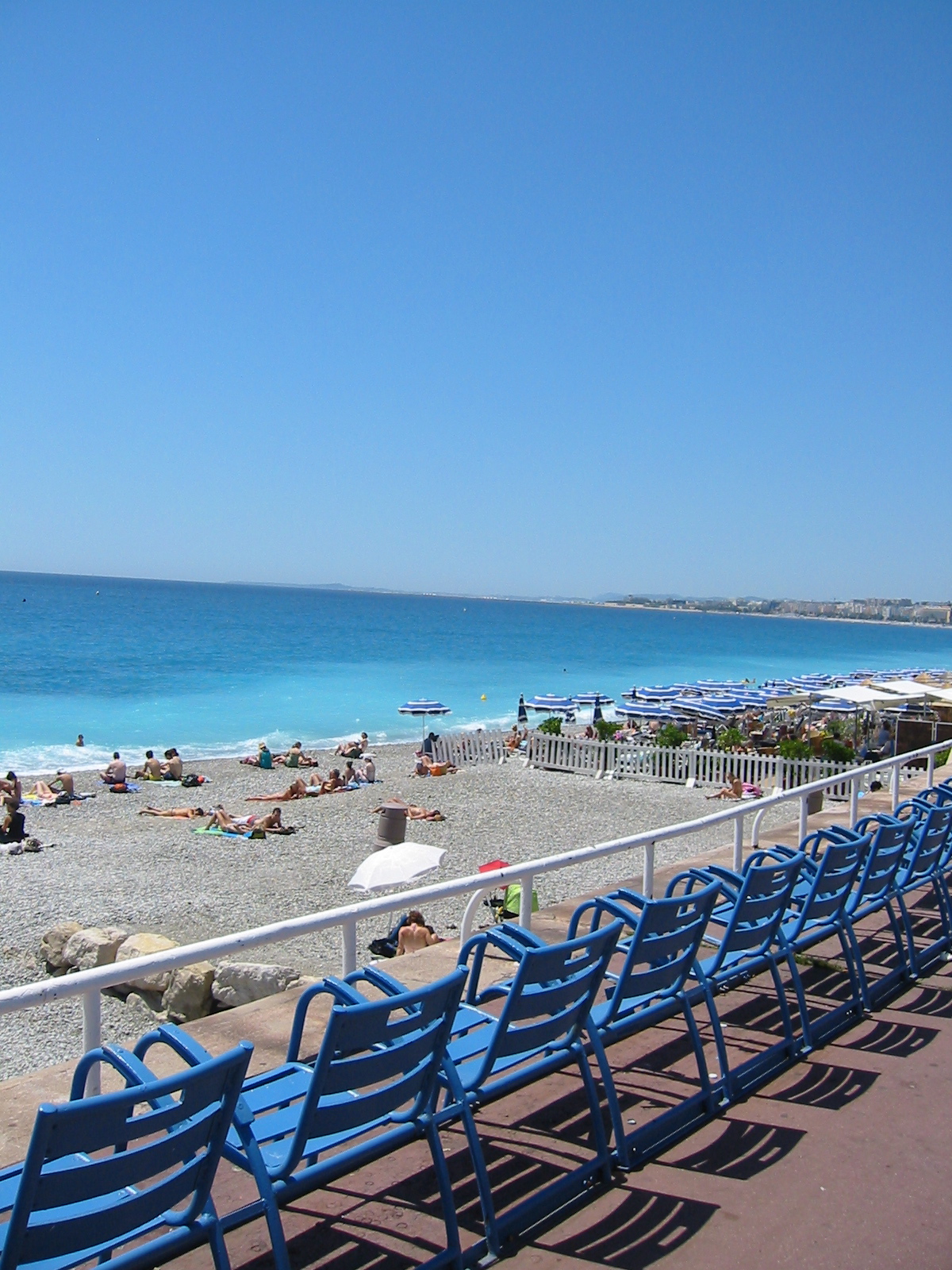 people are at the beach on the sunny day