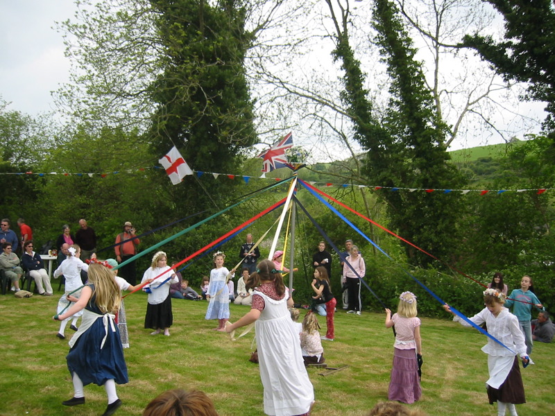 a crowd of people in the field during a festival