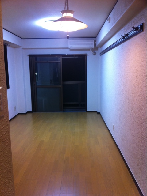 an empty room with wooden floors and walls