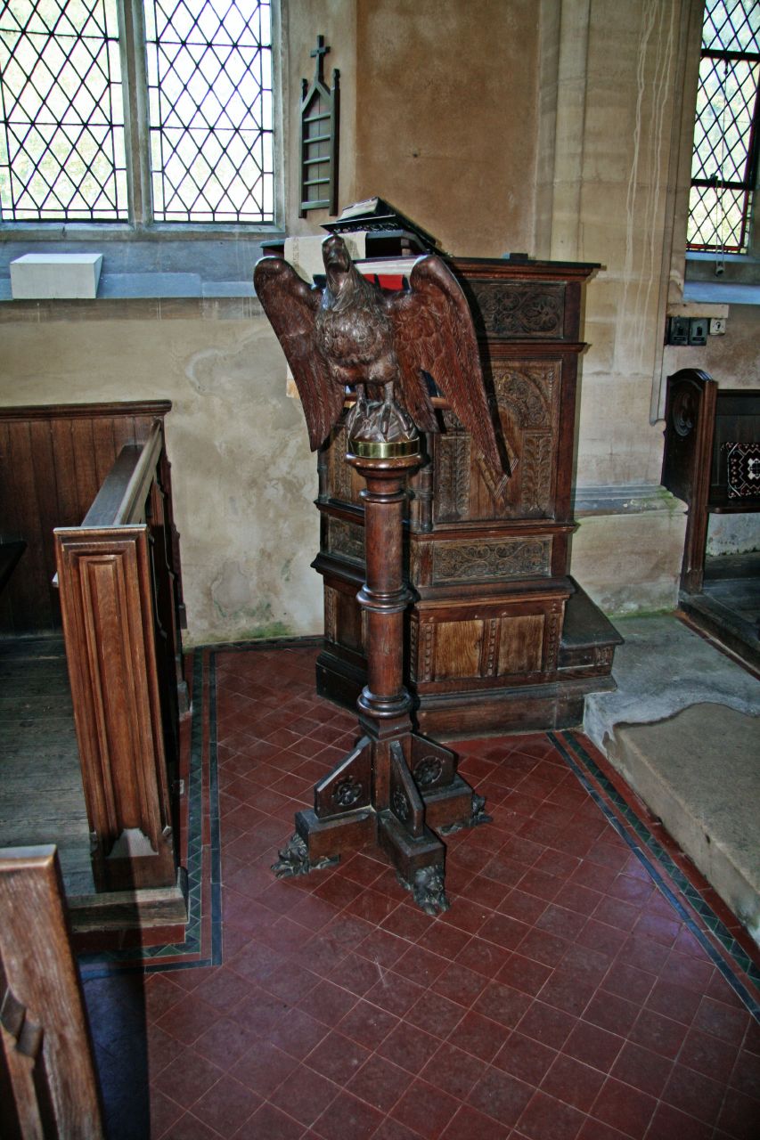 a church alter with an eagle statue on top