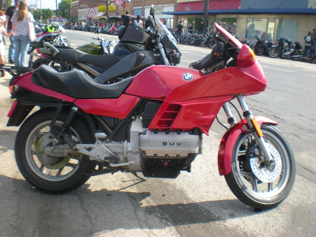 motorcycles are lined up on the side of the road