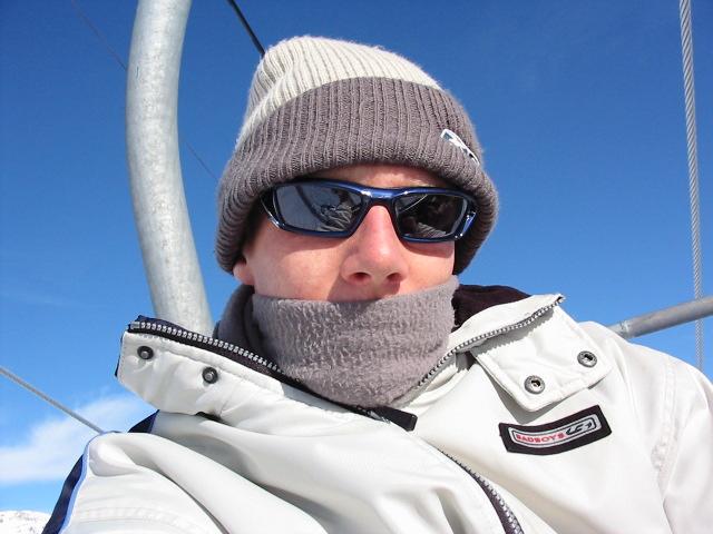 man on a ski lift wearing sun glasses