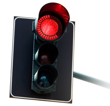 a traffic signal light with a bright red light