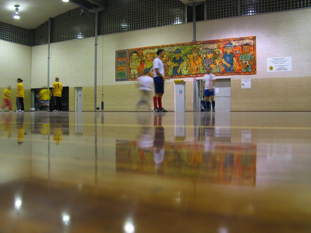 people standing in the hall at an indoor school