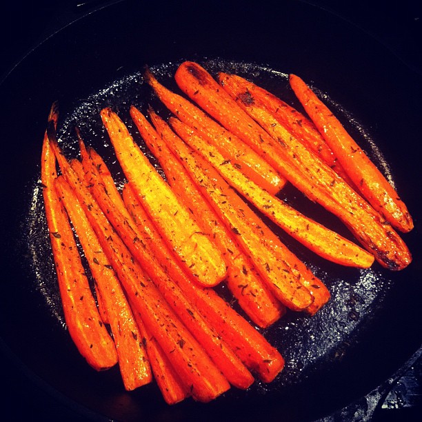 cooked carrots in an iron set on the stove