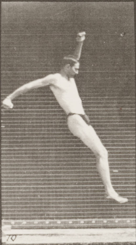 a male tennis player jumping off the court