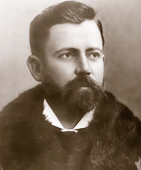 an old po shows a man with a beard and fur collar