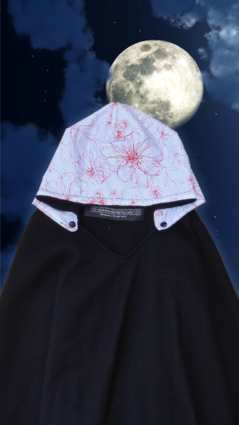 a cape that has been folded with the moon in the background