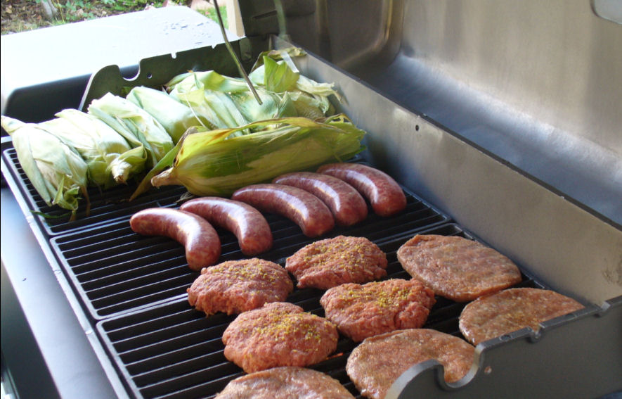 some food is grilling on top of a grill