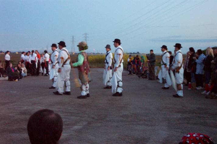 some very pretty men in costumes walking around