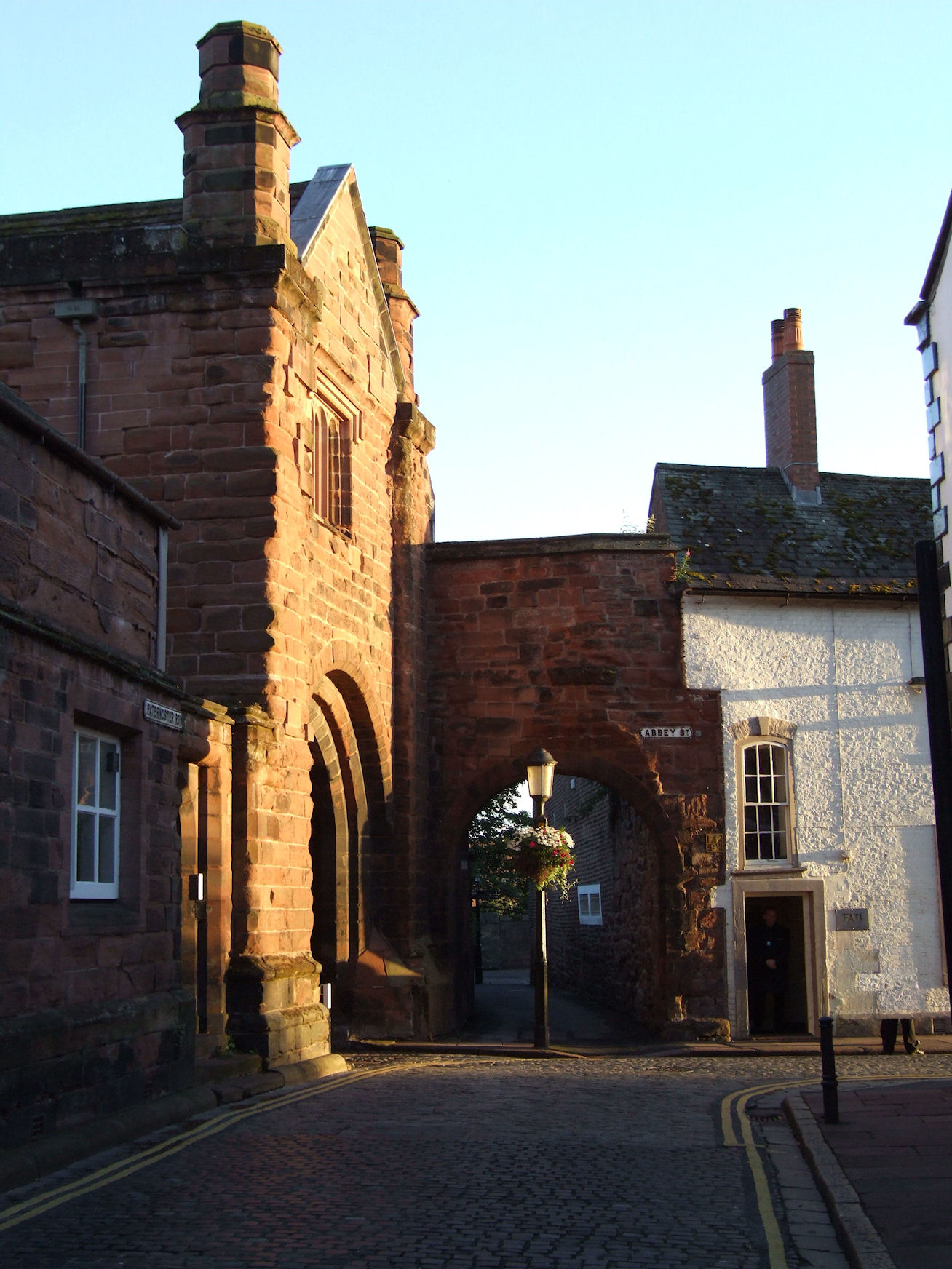 an old stone castle entrance with a gate leading to it