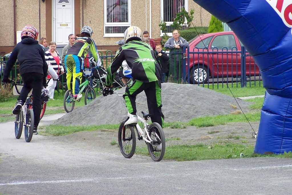 two people are riding bicycles and wearing helmets