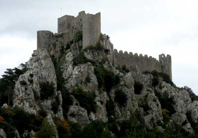 the castle is perched atop of the rock outcropping
