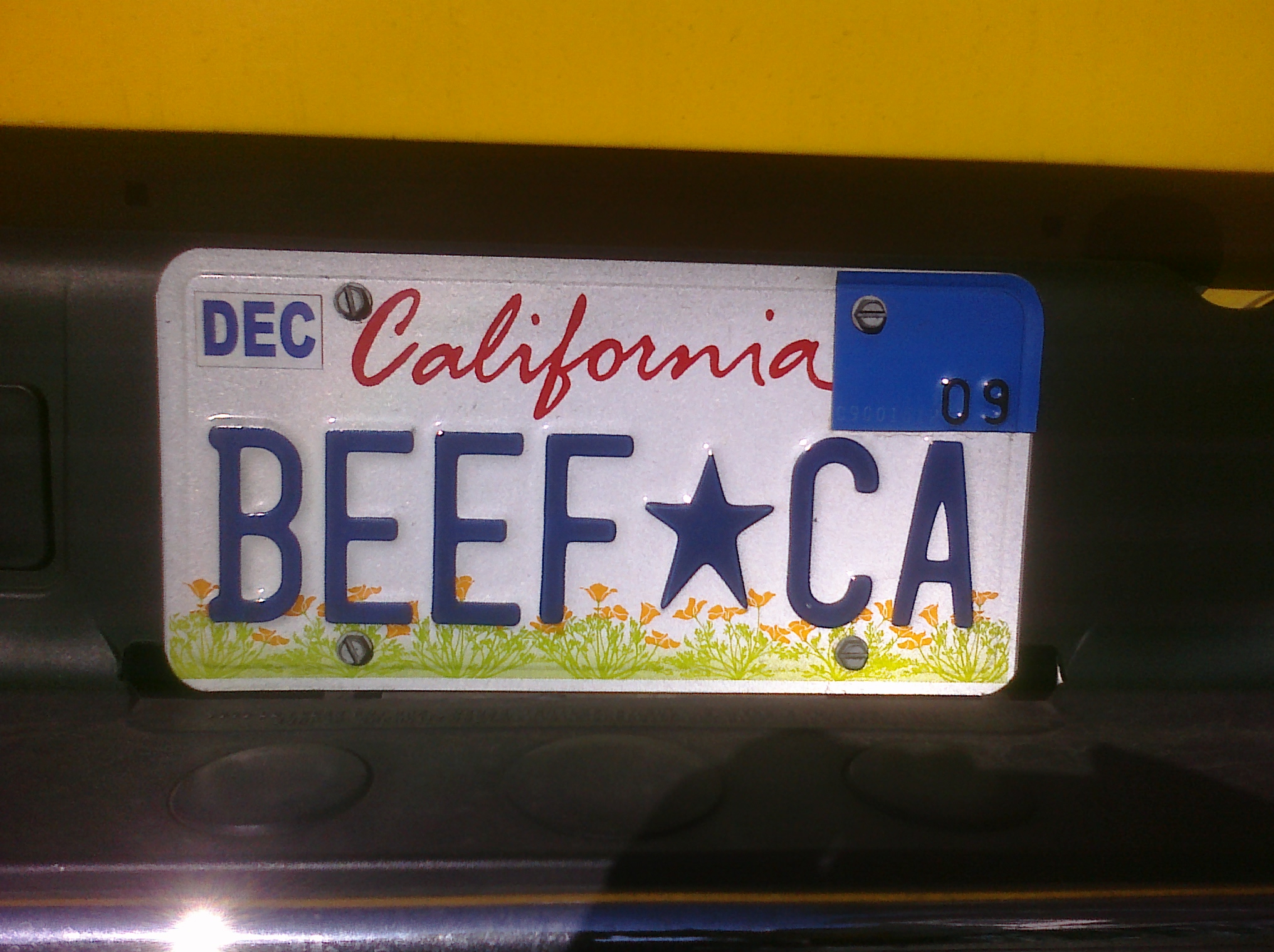 a license plate from the california state is attached to a vehicle