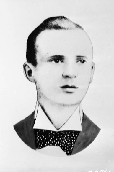 a black and white po of a man with a tie