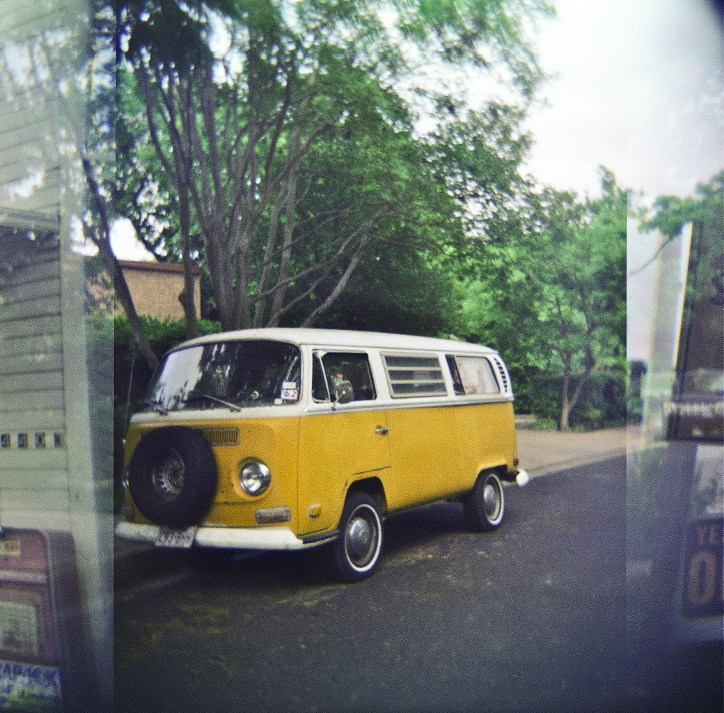 the old time van is parked in the driveway