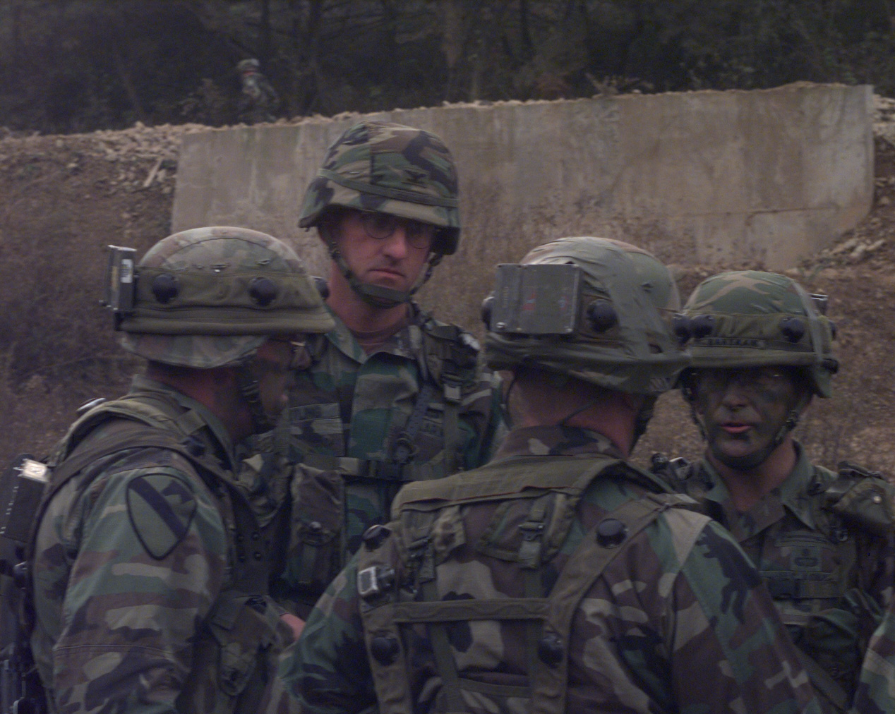 a soldier standing next to another military personnel