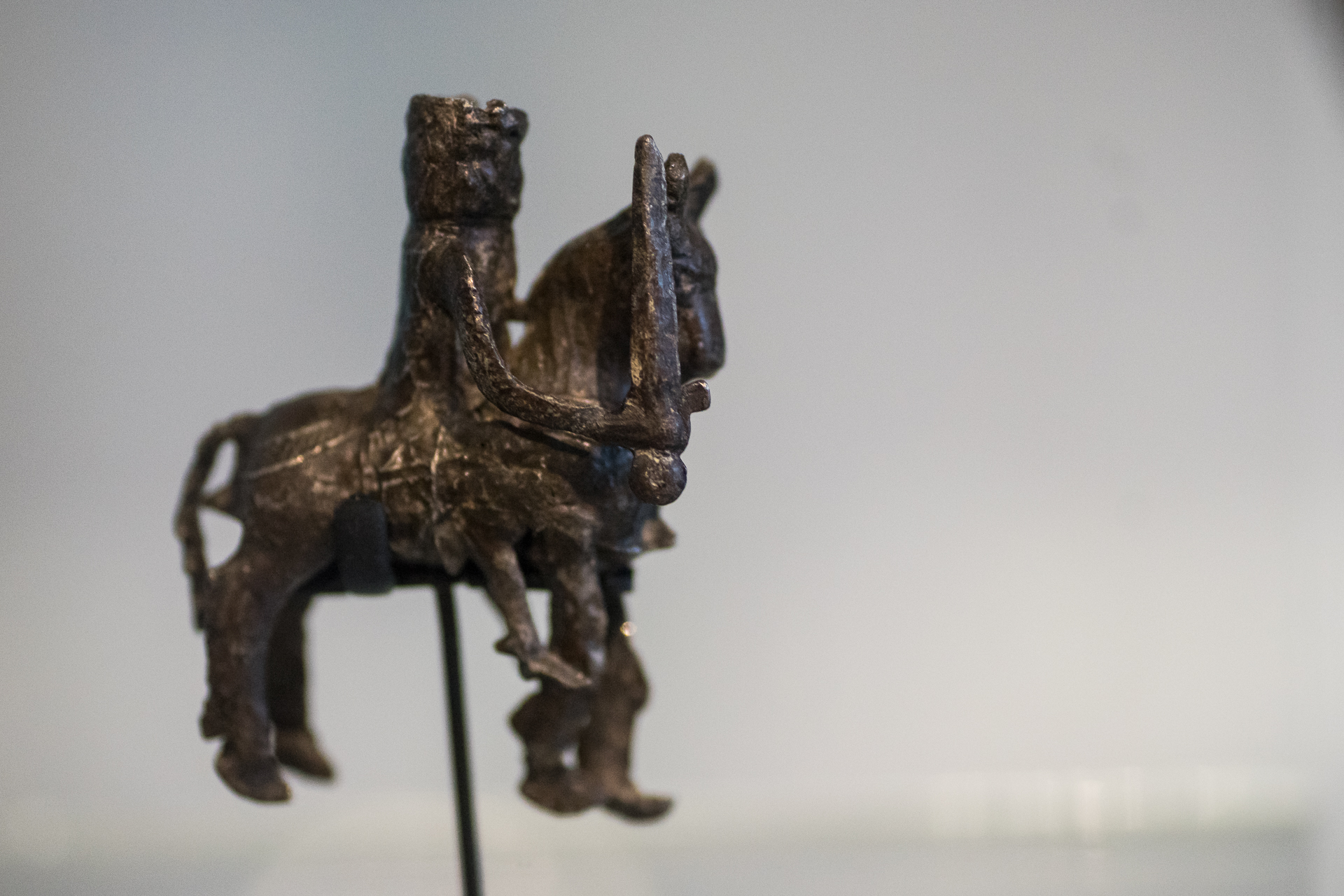 an intricate sculpture of a horse is shown on display