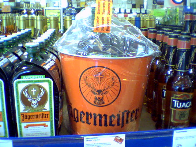 a display of bottles with labels, and containers containing beer