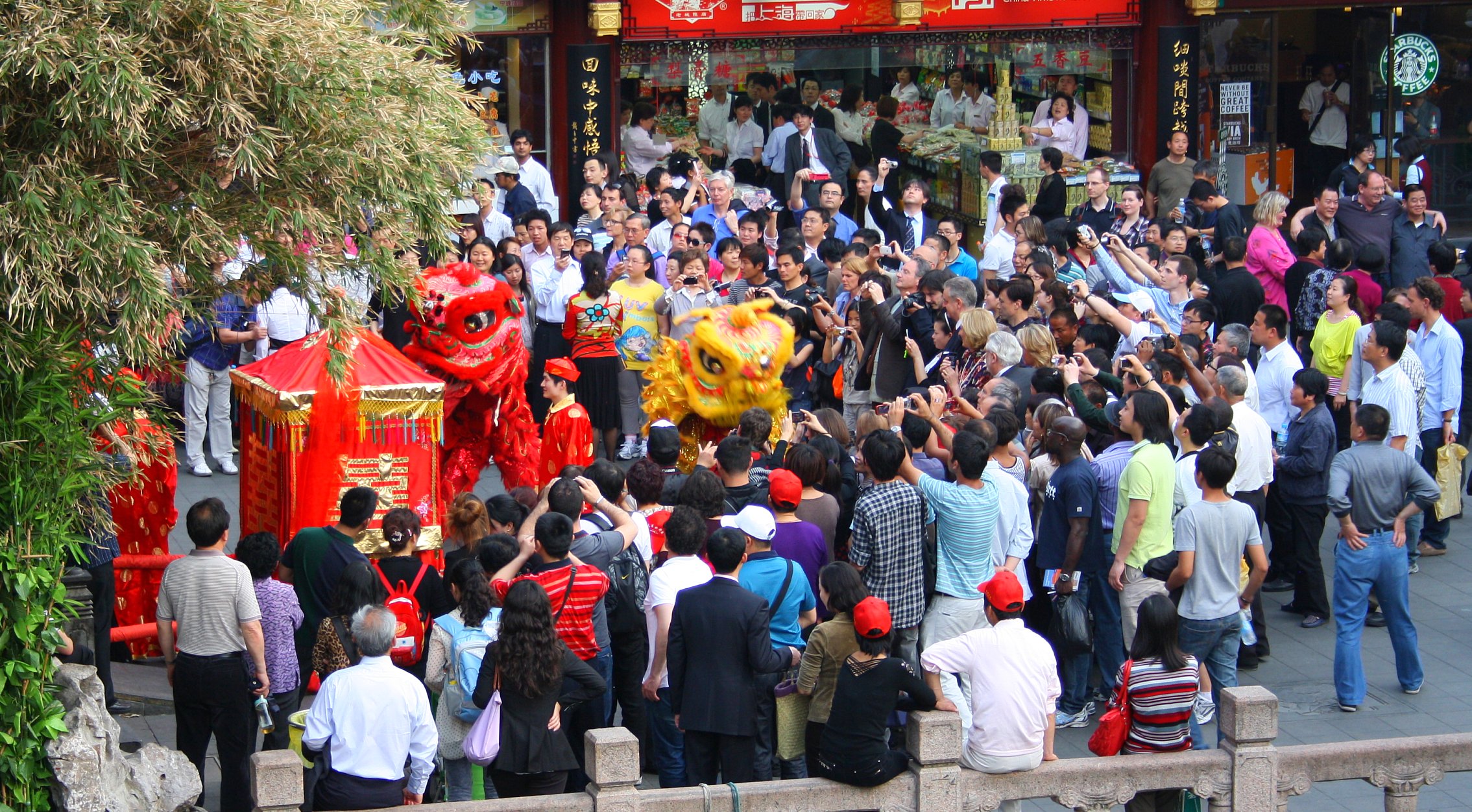 an asian festival of people walking and talking