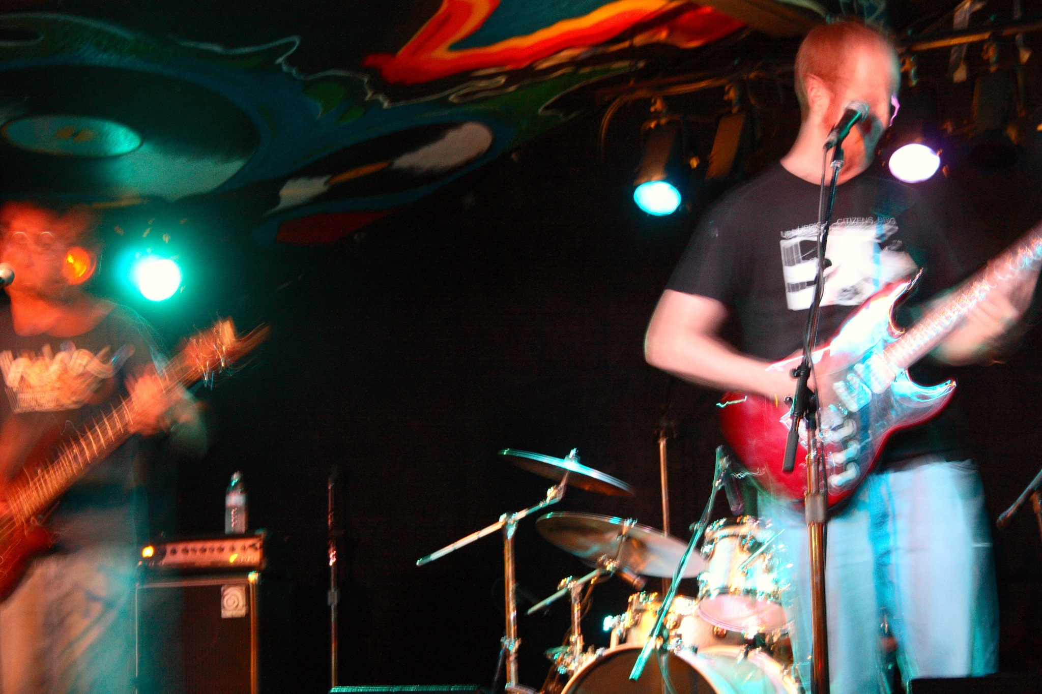 a man playing a guitar at a concert